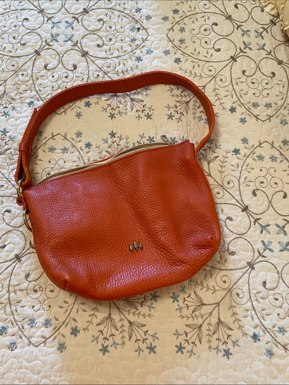 Pebbled Orange Leather Shoulder Bag with Minimal Metal Accent